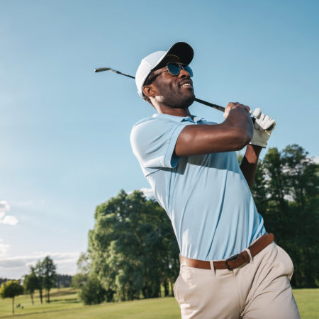 Smiling,African,American,Man,In,Cap,And,Sunglasses,Playing,Golf